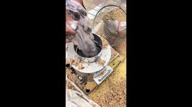 Worker demonstrates chestnut-peeling machine that removes shells instantly