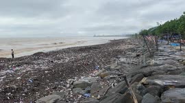 Indonesian beach overwhelmed with litter washing up on shore