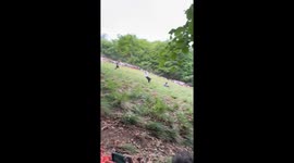 Dramatic fall captured during the exciting Cooper Hill Cheese-Rolling event
