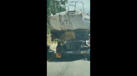 Yacht towed on trailer scrapes against trees and signposts, damaging the vessel