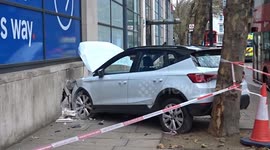 Earls Court car accident has left white Arona car cut into TESCO supermarket wall for several days - Warwick Road W14