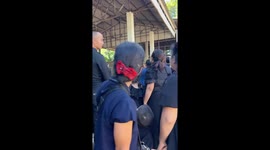 Mourners panic as 13ft python appears on funeral hall roof