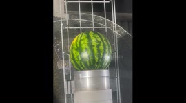 Watermelon reduced to nothing by industrial sandblaster in satisfying footage