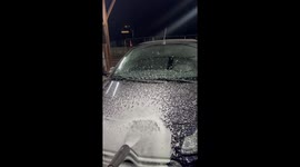 Biker Getting Sprayed in a Car Wash