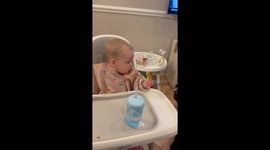 Baby Gives Toast to Dog