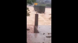 Truck battles through swollen river during Vietnam floods