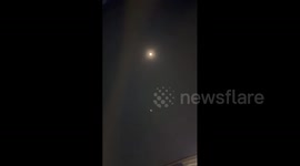 US: Beaver moon in the sky above Los Angeles, CA