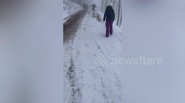 Tot sledges off path as family scrambles to save her in dramatic hill chaos