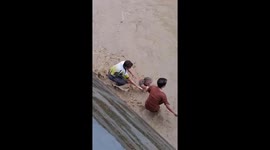 Teachers brave deep floodwaters on the way to remote villages in Leyte, Philippines
