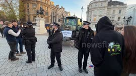 Police officers seize a tractor. Farmers are protesting near Trafalgar Square and Westminster on Budget Day, bringing tractors into central London despite a police ban. The demonstration targets proposed changes by the government to agricultural property
