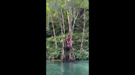Tourist flips over while jumping into lagoon
