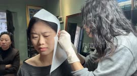 Woman faints during ear piercing in Guangdong, China