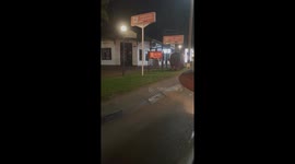 Hippo wanders through town at night in Victoria Falls, Zimbabwe