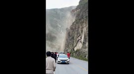 Boulders crash onto mountain road trapping motorists in China