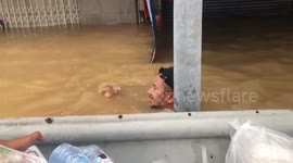 Rescue teams deliver aid to residents stranded in flood in southern Thailand