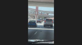 Angry Driver Throws a Bottle at Another Car