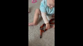 Little Girl Plays With a Big Snake