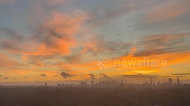 Peaceful sunrise bathes Cambridge skyline in warm light in Massachusetts, USA