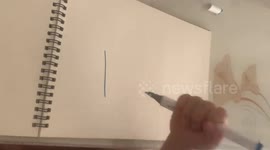 Child proudly shows writing numbers 1 to 10 in Shanxi, China