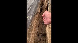 Large road fissure seen after magnitude 6.9 earthquake in Cebu, Philippines