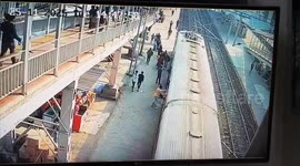 Railway station guard saves mother and son from falling under moving train