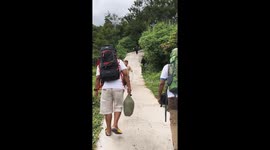 Child loses balance and slides down steep trail during descent in Garut, Indonesia