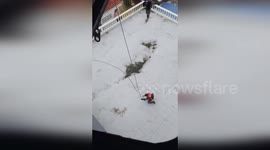 Thailand: Army Helicopter Airlifts Nine Flood Victims In Dramatic ‘Flying Basket’ Rescue Over Hat Yai