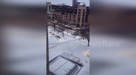 US: Snowfall Transforms Downtown Minneapolis Into Peaceful Winter Scene