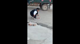 Boy throws a tantrum after dropping his ice cream in Hebei, China
