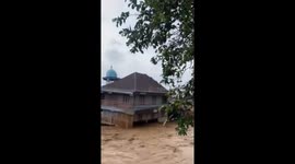 Indonesia flash floods knock down homes as continuous heavy rain batters region