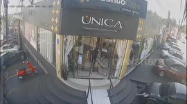 Woman stumbles while exiting salon in Ciudad del Este, Paraguay