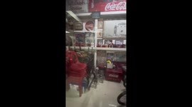 Coca Cola superfan shows collection of bottles, signs and souvenirs