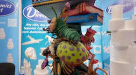Amazing rotating Alice in Wonderland cake showing at the Ideal Home Show At Christmas