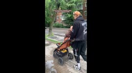 Energetic Toddler Turns Stroller Ride into Bouncy Rodeo During Walk in Russia