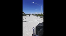 Biker Dodges Car and Dangerous Sign by an Inch