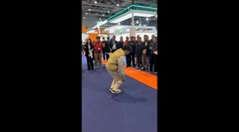 Demonstration of elderly anti-fall safety vest at expo in Guangzhou, China