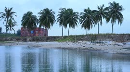 A container barge is stranded in Port Dickson waters near a resort hotel area after being swept away by sea waves following tropical storm Senyar