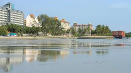 A container barge is stranded in Port Dickson waters near a resort hotel area after being swept away by sea waves following tropical storm Senyar