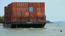 A container barge is stranded in Port Dickson waters near a resort hotel area after being swept away by sea waves following tropical storm Senyar