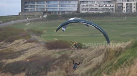 Paragliders ride the wind before Amber and Yellow rain warnings forecast