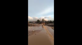 Desperate to cross the flash flood current