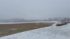 Heavy snowfall quickly covering the landscape in Waunakee, Wisconsin, USA