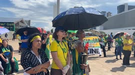 Supporters of former president Bolsonaro protest in Brasilia after his 27-year prison term begins