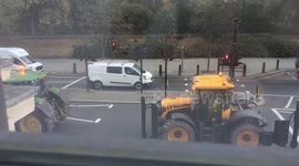 Farmers drive tractors through London in protest at tax