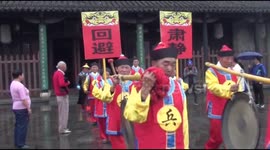 People dressing up as magistrate and officers parade on road