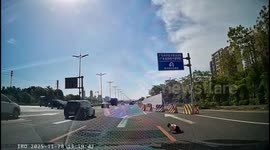 Shocking moment toddler crawls onto busy highway before passing driver rushes to rescue