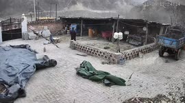 Wind tears roof from outbuilding during storm in China