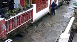 Woman slips into canal while walking home in Medan, Indonesia