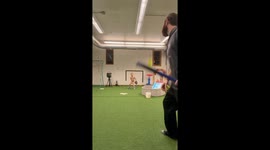 Father and son playing indoor baseball in Illinois, USA