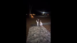 Young daughters rush inside at sound of Santa’s sleigh bells in Alabama, USA